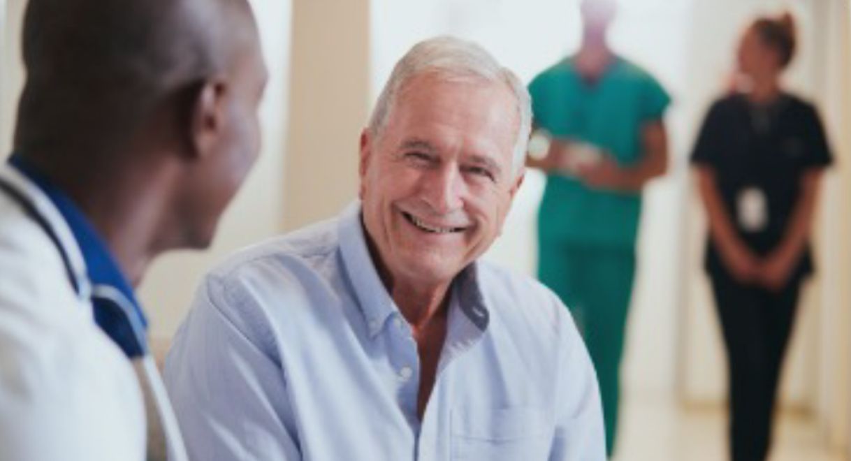 cancer patient talking with a doctor